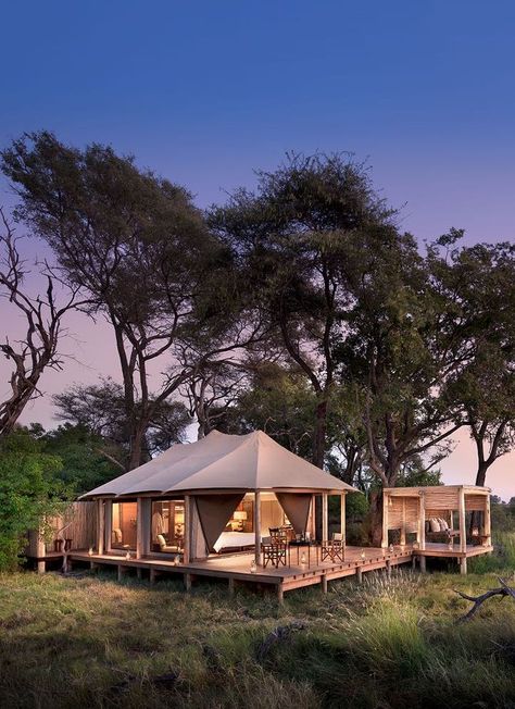 &Beyond Nxabega Okavango Tented Camp has nine luxurious suites, including a family unit comprised of two suites joined by a deck. Each room has both indoor and outdoor showers as well as an outdoor sala, perfect for cool afternoon naps or between-activity game viewing. Slightly elevated, overlooking a lagoon frequented by hippo and elephants, each room offers the utmost in vistas and privacy. Luxury at it's best. Timbuktu Travel. Tented Camp, Chobe National Park, Indoor Camping, Tent Living, Okavango Delta, Family Tent Camping, Safari Tent, Cool Tents, Luxury Safari