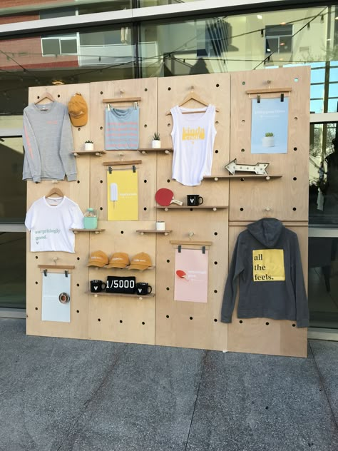 Pegboard Visual Merchandising, Peg Board Store Display, Pegboard Retail Display, Apparel Booth Display, Merch Booth Display Ideas, Merch Display Ideas, Diy Booth Display, Merch Display, Merch Stand