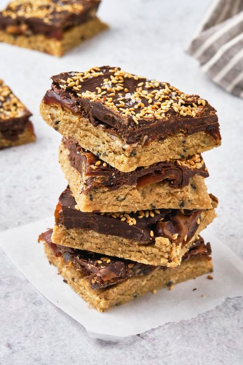 Tahini Date Bliss Bars (vegan, gluten free, wfpb, & refined sugar free!) — Tess Challis Tahini Bars Healthy, Tahini Dessert Recipes, Tahini Cups, Tahini Date, Hu Chocolate, Bliss Bars, Bliss Bar, Vegan Protein Bars, Toffee Bars