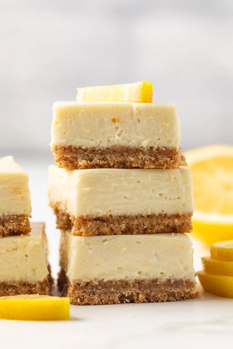 These easy Lemon Cheesecake Bars are ultra creamy and packed with fresh lemon flavor. They are made with a buttery graham cracker crust and lemon cheesecake filling. This recipe is a great alternative to making a full cheesecake! Bars With Graham Cracker Crust, Cheesecake Bars Recipes Easy, Lemon Cheesecake Filling, Cream Cheese Desserts Easy, Creamy Lemon Bars, Graham Dessert, The Best Lemon Bars, Easy Lemon Cheesecake, Cream Cheese Recipes Dessert