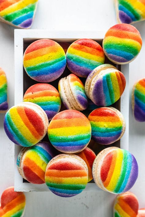 Pride Macarons heart and circle macarons with the rainbow flag #rainbow #macarons #cookies #frenchmacarons #pride #lgbt Rainbow Desert, Rainbow Macarons, Boho Rainbow Macarons, Pride Desserts, Pride Month Baked Goods, Pride Macarons, Fun Shaped Macarons, Rainbow Macaron Tower, Summer Baking Recipes