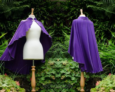 ~ Driud Lily Capelet ~ This is a made to measure Cape, please send me your measurements when placing your order. The original was made in purple with silver grey thread and has a silver clasp.  Perfect for Fanciful Faeries, Gothic Goddesses & Pixchievious Pixies, this cute little cape is a must have for all your wardrobe needs :) Imagine accidentally making it through to Narina without it. NooOOo!  The Druid Lily Capelet is made from lovely stretchy cotton interlock with matching or contrasting thread detail, lettuce-edging & mandarin collar. It has a metal clasp closure at the throat, the clasps that I currently offer are a different style to those photographed on the cape. You can see the new style and colours in the last image. Magical happenings will be unavoidable when wearing this wh Wizard Cape, Purple Cloak, Royal Cape, Purple Cape, Cape Cloak, Elf Clothes, Capes For Women, Cloak, Mandarin Collar