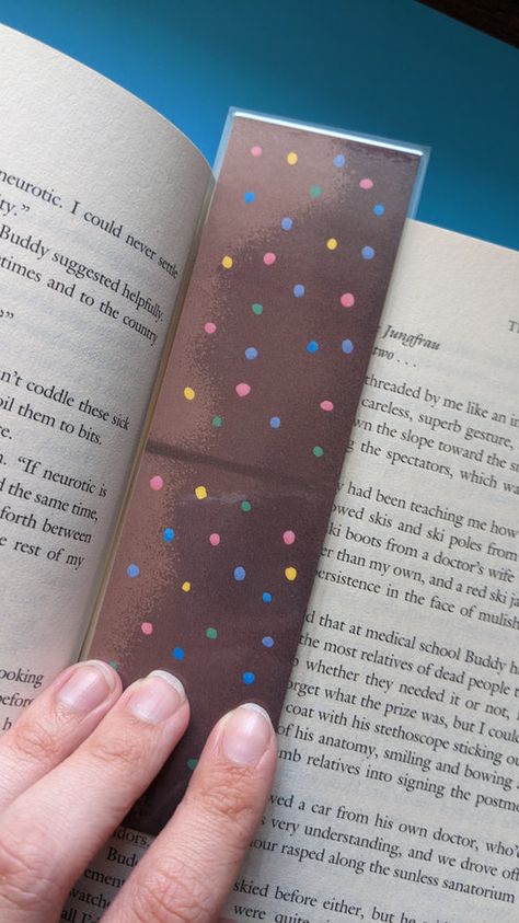 Take your book-reading to the stars with this tasty bookmark! The Cosmic Brownie Bookmark is printed on cardstock and laminated for long-lasting crunchiness - who ever said desserts weren't built to last? Satisfy your sweet tooth and your Book-Tooth all at once! (Yum!) Food Bookmarks, Cosmic Brownies, The Best Dessert, Brownie Desserts, Vintage Inspired Art, Best Dessert, Reading Romance, Retro Pop, Book Reading