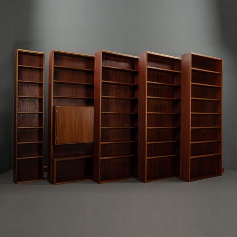 MODULAR WALL BOOKCASE MADE OF MAHOGANY WOOD WITH CUPBOARD COMPARTMENT, SET OF 5. This modular bookcase wall is a carpenter’s handicraft, each of the 5 shelves can be placed separately. In further displays there is another modular bookcase wall with 2 shelves, so there are a total of 7 shelf elements that are offered. The material and the entire workmanship of this furniture are of very high quality, a timeless design that can adapt to your wishes. A shelf element has a closed compartment ... Wall Bookcases, Wall Bookcase, Modular Bookcase, Japanese Home Design, Bookcase Wall, Modular Walls, Stereo System, 2 Shelves, Japanese House