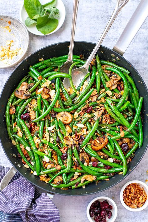 In this recipe, I will show you how to make crunchy and flavoursome sautéed green beans with crispy bacon, mushrooms, garlic, sage, and cranberries. This green bean recipe is a perfect side dish especially for a festive table on Thanksgiving, Christmas or Sunday Roast. It's gluten-free, grain-free, low-carb and paleo-friendly (can be vegetarian, too). Pan Fried Green Beans, Good Green Bean Recipe, Green Beans And Mushrooms, Delicious Green Beans, Green Beans With Almonds, Gluten Free Recipes Side Dishes, The Best Green Beans, Beans With Bacon, Green Beans With Bacon