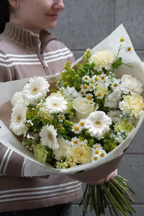 What inside: Gerberas, Daisies, Carnations   This summer flower bouquet is inspired by the charming meadows of the Northern California and a Silicon Valley. This bouquet features a delightful mix of bright yellow and flowers of pastel colors that capture the essence of summer perfectly. Aethstetic Flowers Bouquet, Daisies Flower Bouquet, Bouquet Of Flowers Daisy, Natural Bouquet Flowers, Medium Bouquet Flowers, Yellow Carnation Bouquet, White And Yellow Flower Bouquet, Wedding Flowers With Daisies, Flower Bouquet Inspiration