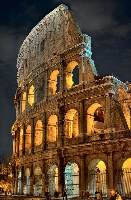 Okay, so the Colosseum wasn't built as of A.D. 65, but the amphitheaters and circuses of the day had a similar presentation, with multi-story archways and pillars (Source: Flickr, Captain Blackadder, The Colosseum at Night) Rome Italy Colosseum, Istoria Artei, Colosseum Rome, Roman Ruins, The Colosseum, Famous Landmarks, Rome Italy, Albania, Places Around The World