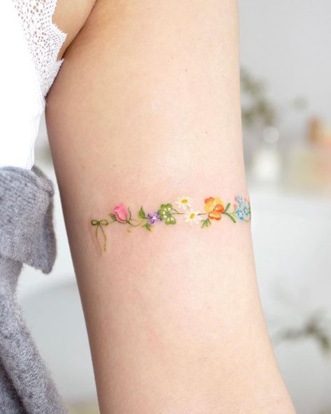 Feminine Tattoos With Color, Small Colored Flower Tattoos, Small Pastel Tattoo, Pastel Flower Tattoo, Cute Color Tattoos, Flower Band Tattoo, Pastel Tattoos, Virgo Flower, Spring Tattoo