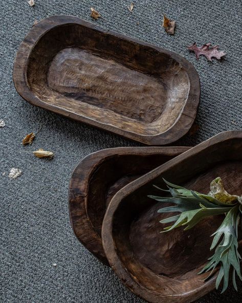 4 ways to refine your space with a rustic wood bowl: 1. Choose a wood bowl that complements your room's style and color scheme. 2. Place the bowl as a centerpiece on a table and fill it with decorative items like pinecones or dried flowers. 3. Utilize the bowl functionally by using it to hold keys or small items in an entryway or on a countertop. 4. Pair the wood bowl with other natural elements for a cohesive and inviting look. These bowls are available on CasaRefinedShop.com Wooden Bowls Aesthetic, Trays On Ottomans Ideas, Trays Decor Bedroom, Rustic Wood Bowl, Organic Modern Kitchen, Dough Bowls, Decoupage Ideas, Organic Modern Decor Living Room, Belgian Style