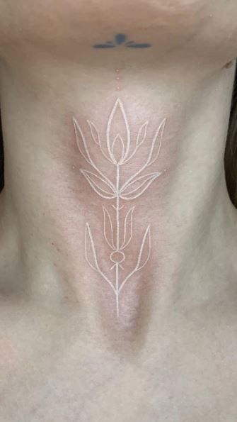 White Ink Tattoo Blacklight, White Ink Face Tattoos For Women, White Neck Tattoo, White Ink Neck Tattoo, White Tattoo Face, White Chest Tattoo, Front Of Neck Tattoos Women, White Tattoo Aesthetic, White Tattoo Healed