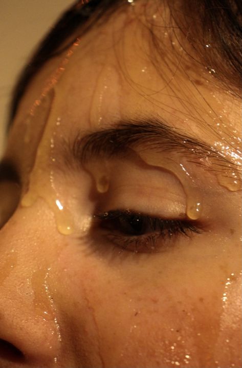 earth warm tones to create the glossy honey look with a human eye Honey Dripping Photography, Up Close And Personal Photography, Up Close Photography Faces, Shower Photography Woman, Honey Portrait, Tears Photography, Painting Photoshoot, Artsy Pants, Beauty Moodboard