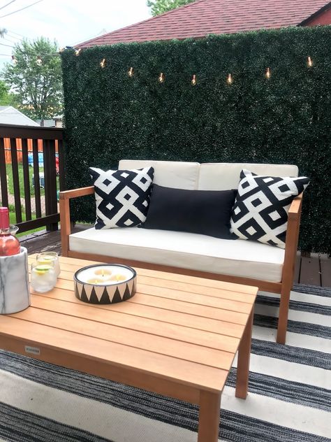 chic outdoor space. black and white deck inspiration Deck Accent Wall, Boxwood Patio Wall, Outdoor Accent Wall Patio, Patio Greenery Wall, Faux Boxwood Wall Outdoor, Boxwood Accent Wall, Patio Accent Wall, Boxwood Wall Decor, Outdoor Accent Wall