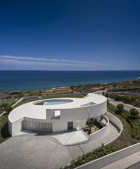 View full picture gallery of Elliptical House Funny Real Estate Quotes, Mario Martin, Funny Real Estate, Lagos Portugal, Concrete House, Real Estate Quotes, Modern Mansion, Round House, Minimalist Architecture