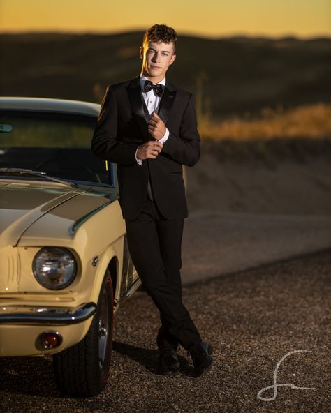 Senior Guy wearing a black tux next to his classic car for Senior pictures Couple Poses Matric Farewell, Boys Homecoming Pictures, Couple Photography Poses For Prom, Individual Prom Picture Ideas Guys, Prom Photos With Car, Prom Poses Single Male, Prom Pics With Car, Photo Shoot Poses For Men, Matric Dance Photoshoot Ideas