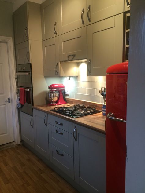 My small khaki coloured kitchen with red fridge and Kitchenaid. I love it! Red Refrigerator Kitchen, Kitchen With Red Fridge, Red Fridge Kitchen Design, Red Appliances In Kitchen, Kitchen With Red Appliances, Red Fridge Kitchen, Colourful Fridge, Red Kitchen Accents, Valentines Decorations For Home