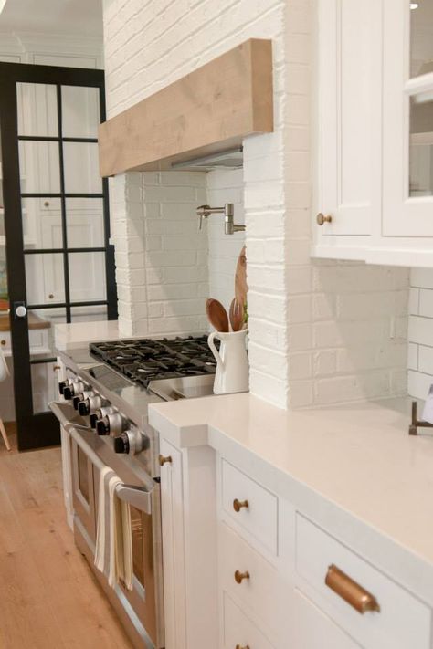 white painted brick range hood with wood trim Bay Window Living Room, Brick Backsplash Kitchen, Sage Green Kitchen, Brick Kitchen, Kitchen Range Hood, Island Countertops, Kitchen Hoods, Vent Hood, Scandinavian Kitchen