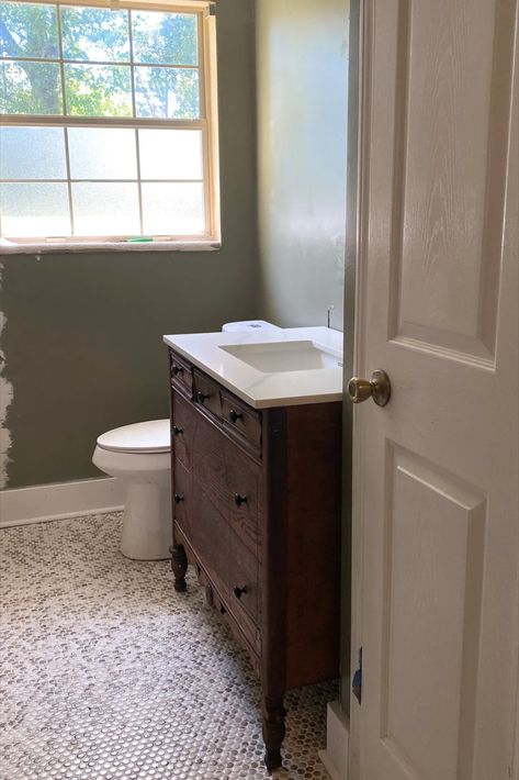 Bathroom remodel with conversion of vintage dresser into a bathroom vanity. White penny tile floors with moody green walls. Bathroom Vanity Renovation, Bathroom Vanity Antique, Vanity Antique, Dresser Vanity Bathroom, Vintage Bathroom Vanity, Antique Bathroom Vanity, Dresser Diy, House Flip, Functional Bathroom