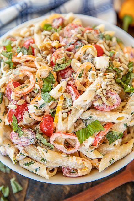 Buttermilk Pasta Salad - the BEST pasta salad ever!! Great for a crowd! Pasta, tomatoes, chives, sweet peppers, basil, cucumbers, onion, sunflower seeds, and feta tossed in a delicious homemade buttermilk dressing made with mayonnaise, lemon juice, hot sauce, garlic, chili flakes and pepper. Add some canned tuna or cooked chicken for a meal! Can make in advance and refrigerate until ready to serve! #easy #pastasalad #recipe #sidedish #pasta Best Pasta Salad Ever, Pasta Dressing, The Best Pasta Salad, Cold Salads, Buttermilk Dressing, Easy Pasta Salad Recipe, Best Pasta, Best Pasta Salad, Canned Tuna