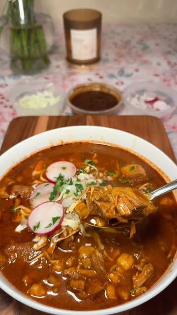 JENN JIMENEZ🌹✨ on Instagram: "Helping the new generation of tias, one day at a time. 🫶🏻🙂‍↔️✨

The cold weather calls for it, let’s make a pozole rojo. ❤️ #pozolerojo #pozole #caldo #pozoleseason #mexicanfood #mexicanrecipes #recetasfaciles 
 
What you need ✨ 
1. 2lbs Espinazo de puerco 
2. 2lbs Trozo de pierna de puerco
3. 10 Chiles guajillos 
4. 6 Chile anchos 
5. Precooked hominy
6. 18 cloves of garlic 
7. 1 onion 
8. 2 bay leafs 
9. 1 tsp cumin
10. 1 tsp whole black pepper 
11. Chicken bouillon 
12. Beef bouillon 
13. Repollo (cabbage)
14. Radishes 
15. Diced onions
16. Diced cilantro
17. Lemon 

Steps ✨
1. Soak your pork meat for 30 minutes and rinse ever so often until your water is clear.
2. In a pot add your onion, bay leaf’s, garlic, salt and pork. Bring to a boil and skim off