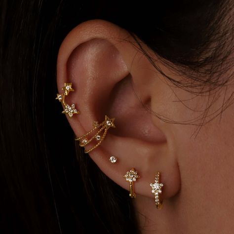 Star Themed Ear Piercings, Ear Piercings Diamonds, Space Themed Ear Piercing, Multi Earrings Piercing, Silver Earrings Stack Aesthetic, Piercing Sets Ear, Celestial Ear Stack, Moon Helix Piercing, Different Cartilage Piercings