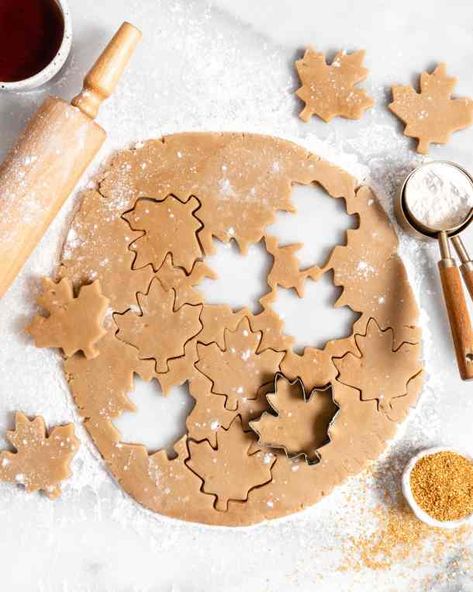 maple sugar cookie rolled out dough with cut out maple leaf cookies Maple Sugar Cookies, Maple Leaf Cookies, Thanksgiving Servings, Maple Cookies, Milk Chocolate Chip Cookies, Yummy Sugar Cookies, Caramel Buttercream, Leaf Cookies, Maple Sugar