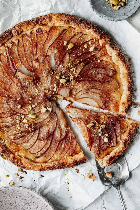 This beautiful (and easy) rustic pear galette nestles juicy pears inside a flaky, buttery crust flecked with cinnamon, sugar, and spicy ginger. Pear Galette Recipe, Pear Gallette Recipe, Cozy Desserts, Galette Recipes, Pear Galette, Whole 30 Dessert, Rough Puff Pastry, Pear Ginger, Pear Dessert