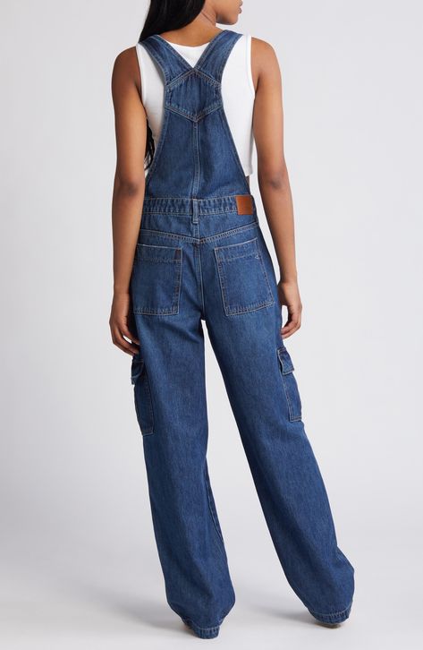 Cargo pockets and a baggy fit up the utilitarian appeal of these classic overalls cut from nonstretch denim with a dark-wash finish. 32" inseam Square neck Adjustable buckle straps 100% cotton Machine wash, tumble dry Imported Casual Cheap Overalls With Side Pockets, Cheap Relaxed Fit Denim Jumpsuit, Baggy Overalls Outfit, Styling Overalls, Denim Overalls Outfit, Minion Outfit, Cargo Overalls, Baggy Overalls, Retro Outfit