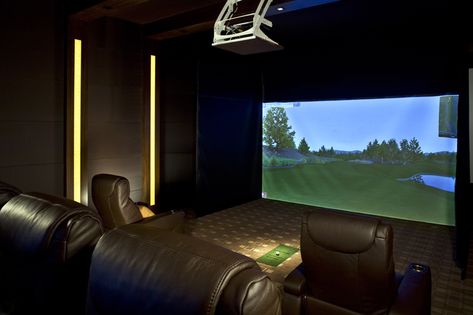 This home theater features an integrated golf simulator, LeGrande incliners, an Acoustic Room System, and LED column lighting. Get inspired! Modern Home Theater, Modern Media Room, Home Golf Simulator, Media Room Seating, Golf Simulator Room, Golf Room, Theatre Interior, Media Room Design, Golf Simulator