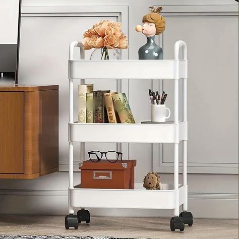 PRICES MAY VARY. Storage Cart : Keep supplies and essentials neatly stored and easily visualize and access storage. Suitable for closets, kitchens, bathrooms, garages, laundry rooms, offices. Easy To Move : There are four wheels that can rotate 360 degrees,and two of them are lockable,and you can slide them at will. Even if it's heavy, you can easily move it. Convenient for your storage. Light material : Made of sturdy plastic, which can be used by you for a long time. The storage box is made of Storage Cart On Wheels, Rolling Cart Storage, Shelf For Kitchen, Cart Storage, Cart On Wheels, Organization Cart, Rolling Storage Cart, Storage Trolley, Bookshelf Storage