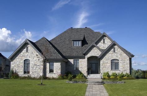 A sturdy-looking luxury stone house in light and dark tones of gray. Houses With Stone Exterior, Brick And Stone House, Grey Stone House, Stone Front House, Brick Roof, Stone Exterior Houses, Stone Exterior, Brick Exterior House, Architecture Model Making