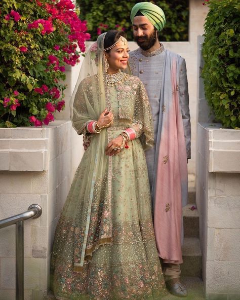 So damn gorgeous sage green lehenga with intricately detailed work and a cape style blouse! #indian #bride #lehenga #green #latest भारतीय दुल्हन संबंधी, Pastel Lehenga, Sabyasachi Lehenga, Bride And Groom Outfit, Designer Bridal Lehenga, Green Lehenga, Choli Designs, Indian Bridal Dress, Indian Bride And Groom