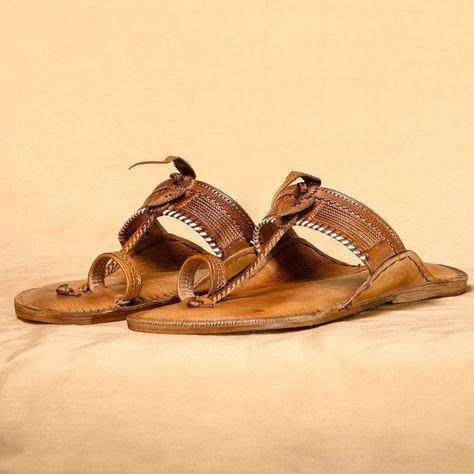 Embrace the rustic allure of our Orange Brown Kolhapuri Chappals. The warm tones of orange and brown blend seamlessly, creating a striking and earthy appearance. Perfect for those who appreciate the beauty of nature, these chappals exude warmth and timeless appeal. -Geographical Indication (GI Mark), Mark of Authenticity you can rely on...! The GI (Geographical Indication) mark for Kolhapuri chappal authenticates its origin, ensuring that its unique craftsmanship and traditional techniques ... Kolhapuri Chappals, The Beauty Of Nature, Orange Brown, Traditional Techniques, Natural Beauty, Orange, Beauty