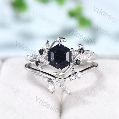 Blue Sandstone looks black when you see it from a distance. When you look close at it, you will see countless blue-purple grains on it.  Single blue sandstone engagement ring here: https://www.etsy.com/listing/1227573563/hexagon-blue-sandstone-ring-cute-vintage?click_key=d52926f4558cc0209047b6e668cd33baf6c5b5c8%3A1227573563&click_sum=c1169cb8&ref=shop_home_active_2&pro=1&frs=1 ≫≫ Item Details  Make every ring to order, all rings are handmade in the United States.  Metal: Solid 10K & 14K & 18K Go Engagement Rings Dark Stone, Black Sapphire Wedding Jewelry, Obsidian Engagement Ring, Dark Wedding Rings, Sandstone Wedding Ring, Black Rhodium Engagement Ring, Blue Sandstone Ring, Blue Sandstone Engagement Ring, Sandstone Engagement Ring