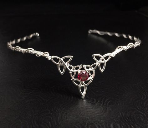 I will fabricate this Celtic Knot inspired wedding circlet, or diadem, in sterling silver with an 8mm gorgeous and stunningly merlot colored faceted Garnet gemstone, which I set in a sturdy 4 prong sterling silver setting. This is perfect for an Irish wedding, a Renaissance themed one! This piece has a Celtic vibe, yet still elegant to blend nicely with a classic style gown, too. Perfect for those celebrating their Celtic, Irish or alternative spirit, yet elegant and classy for any bride-to-be! Viking Bridal Crown, Viking Themed Wedding Tiara, Viking Wedding Jewelry, Viking Wedding Cake Topper, Viking Wedding Crown, Celtic Themed Wedding, Norse Viking Wedding Ideas, Wiccan Wedding Dress, Nordic Wedding Ideas