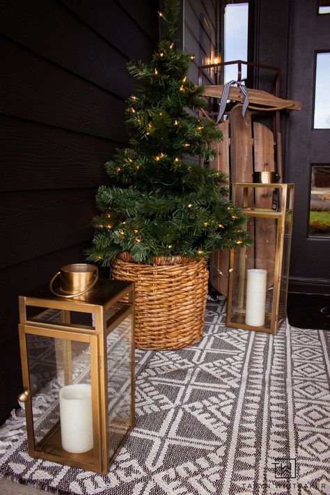 Mini pre-lit Christmas trees in baskets for a classic look paired with lantersn and wreaths. Christmas Trees In Baskets, Christmas Tree Porch, Christmas Tree Basket, Tree In Basket, Christmas Tree In Basket, Vintage Sled, Window Decorations, Square Baskets, Pre Lit Christmas Tree