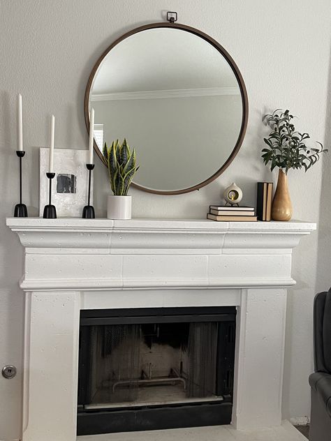 Decor On Top Of Fireplace, Mantle With Artwork, Mantle With Circle Mirror, Scandi Fireplace Decor, Circle Mirror Above Fireplace, Living Room Fireplace Mantel Decor, Circle Mirror Fireplace Mantles, Cream Fireplace Decor, Top Of Chimney Decor Fire Places