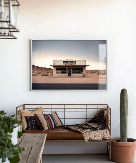 "This minimalistic desert landscape print, entitled \"Lou's Liquor\" is print #5 of 7 in our Roadside Remains Series! This wall decor is the perfect piece for any western, southwestern, or bohemian home. The simple design is great for a home bar or wine room, and the smaller format makes a great addition to a gallery wall. Our Roadside Remains Series posters make a great gift for the road tripper in your family as they're inspired by the long-forgotten places you'll see on a road trip west! *Ple Western Bohemian Decor, Western Minimalist Decor, Modern Western Home Decor Living Rooms, Simple Western Home Decor, Desert Aesthetic Decor, Modern Western Decor, Eclectic Bar, Modern Western Home Decor, Wall Art For Men