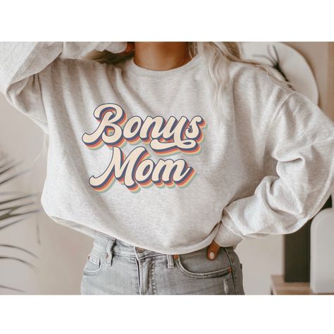 Bonus Mom Shirt for Step Mom or Foster Mom - Bonus Mom Gifts for Mother's Day - Retro Print Shirt - Best Bonus Mom Ever Sweatshirt ♥♥UNISEX CREWNECK SWEATSHIRT ♥♥ PLEASE CHECK THE SIZE CHART IMAGE TO HELP YOU CHOOSE THE BEST FIT! :) We add our size chart as a reference, so please make sure that you are selecting carefully. Once an order is received it goes into production and we are unable to cancel orders. ♥♥Of course if there is an issue with your order, please message us and we will try our b Bonus Mom Shirt, Bonus Mom Gifts, Funny Holiday Shirts, Sport Shirt Design, Gifts For Mother's Day, Bonus Mom, Step Mom Gifts, Step Mom, Retro Sweatshirts