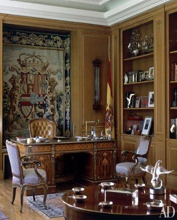 KING JUAN CARLOS I'S PALACIO DE LA ZARZUELA: In the king’s office, an 18th-century tapestry depicting the coat of arms of Spanish monarch Philip V hangs behind a contemporary pedestal desk by marquetry expert Rafael de la Concepción. Beautiful Home Library, Tree House Interior, Study Room Furniture, King Of Spain, Luxury Office Furniture, Historical Interior, Manly Decor, Classic Desk, Luxury Office