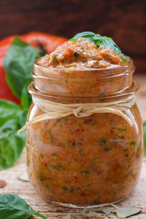 This tomato pesto will redefine the way you think of classic pesto, using roasted tomatoes and garlic to provide an extra kick of flavor and richness. Roasted Tomato Pesto, Roasted Tomatoes And Garlic, Roasted Tomato And Garlic, Garlic Pesto, Baked Garlic, Tomato Pesto, Roasted Tomato, Sliced Almonds, Stuffed Sweet Peppers