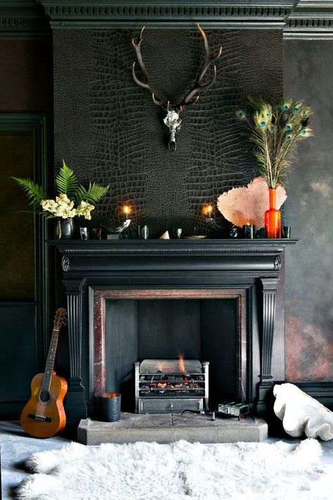 Create a dramatic focal point in your living room with a dark, contrasting wall and textured wallpaper. Interior Room Decoration, Interior Decorating Living Room, Small Hall, Living Room Ornaments, Hall Decor, Decorating Shelves, Dark Interiors, Fireplace Wall, Salon Decor