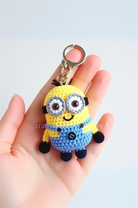 This delightful mini crochet Minion keychain encapsulates the playful spirit of the mischievous characters known from popular culture, all within a compact and cuddly amigurumi design. Minion Keychain, Crochet Keyring Free Pattern, Minion Crochet Patterns, Minion Pattern, Keychain Patterns, Disney Crochet Patterns, Crochet Keychains, Minion Crochet, Keychain Craft