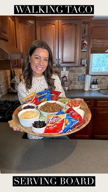 Tara Panasiuk on Instagram: "WALKING TACO BOARD 🌮❤️ So fun and delicious for entertaining and those dinner nights in 🤗 Put together your favorite taco ingredients to choose from, crush some bags of chips and put your customized ingredients inside. Enjoy! 💕 Also obsessed with this sweater! Saved in my stories and comes in a few colors 🥰 #foodboard #tacorecipe #easyrecipes #entertainingathome #recipeideas #recipeoftheday" Walking Taco Board, Salad Boards, Taco Board, Walking Taco, Charlie Brown Tree, Walking Tacos, Taco Ingredients, Diy Santa, Charcuterie And Cheese Board