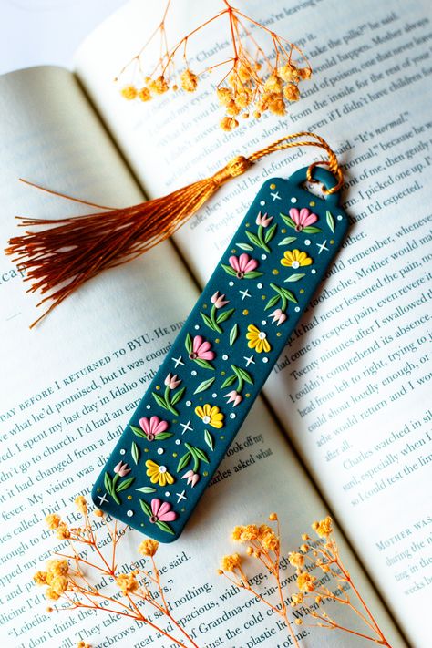 Ready to ship in 1-3 business days. Handmade polymer clay floral bookmarks are made in Canada with love, each detail at a time. This bookmark will last you your entire life, won't break when dropped and is flexible to ensure maximum durability for the avid reader in your life! Choose between two different tassel colours.  Product + Material Information: - handmade in Canada - polymer clay - lightweight and durable Size & Weight Information Height: 5" Width: 1" Weight per pair: 5g Care Instructio Bookmark Product Photography, Diy Clay Bookmarks, Clay Teacher Gifts, Diy Book Lover Gifts, Bookmark Polymer Clay, Fimo Bookmark, Polymer Bookmark, Air Dry Clay Bookmark, Polymer Clay Art Ideas