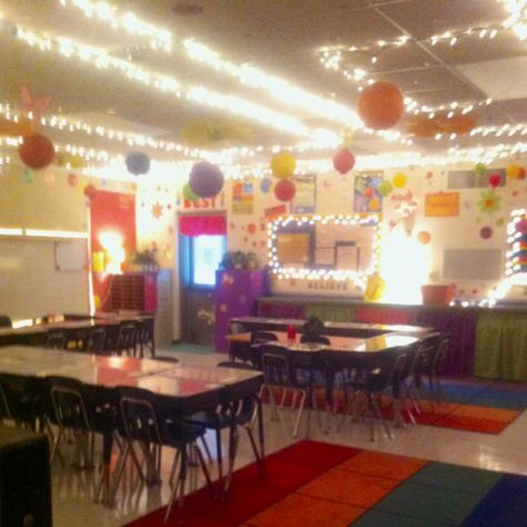 Classroom decorating ideas. I like lots of lights and lamps in my classroom rather than always using those harsh florescent lights. Also it is good to have the extra light when using the promethean board so I can see the students and they have enough light to be able to work. I use gem clips to hang Christmas lights around the ceiling and also put them around bulletin boards. Lamps are placed throughout the room. It's cozy and the kids love it. Classroom Lights, Classroom Lighting, Dance Classroom, Classroom Ceiling, Promethean Board, Cozy Lighting, Dream Classroom, Fluorescent Lights, Classroom Decor High School