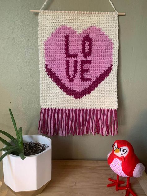 Valentine's Day Crochet Wall Hanging - The Very Hungry Crafter Valentines Crochet Wall Hanging, Valentine's Day Crochet, Crochet Wall Hanging, Fabric Steamer, Classic Candy, Crochet Wall Hangings, Conversation Hearts, Wood Sticks, Converse With Heart