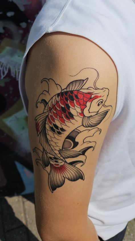 Red and black koi fish tattoo on a shoulder. Koi Fish Tattoo Men Arm, Koi Fish Tattoo Men, Japanese Koi Fish Tattoo Sleeve, Fish Tattoo Men, Koi Fish Tattoo Sleeve, Fish Tattoo Sleeve, Tattoo Men Arm, Japanese Koi Fish Tattoo, Soft Tattoo