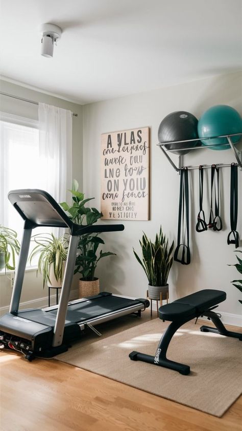 Create a stylish and practical home gym for women! 🧘‍♀️ This airy space includes a foldable treadmill, compact weight bench, and wall-mounted storage for all your gear. Motivational wall art and potted plants add the perfect finishing touches. 🌿 #GymInspiration #HomeFitnessSpace #Home #Creating #HomeIdeas #InteriorInspo #for #Ideas #Gym #Your #Own #Spaces #HomeDecorating #Compact #Mini #Workout Garage Gym Treadmill, Home Gym Ideas Carpet, Multipurpose Gym Room, At Home Gyms Ideas, Modern Farmhouse Gym Room, Home Gym Styling, Gym Interior Design Ideas Small Spaces, Small Bedroom Home Gym, Women’s Home Gym