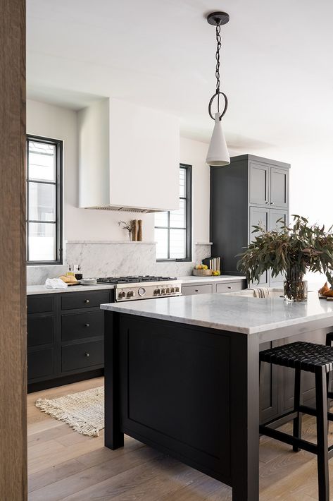 Modern Farmhouse Black Kitchen, Kitchen Black Glass Cabinets, Transitional Kitchen Black Cabinets, Modern European Cottage Interiors, Organic Modern Kitchen Black Cabinets, Moody Clean Kitchen, Black Farmhouse Kitchen, Modern Farmhouse Black Range Hood, English Modern Interior