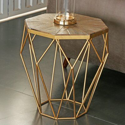 CORNER COLLECTION "Like a diamond in the rough" is the perfect way to describe this octagonal end table, which combines a faceted golden base with a unique parquet top of the recycled wood. This octagonal sunburst End Table blends with, and accents your living room collection. Gold geometric profile holds rays of reclaimed wood to create this side table an elegant choice for your open concept living space. Geometric Side Table, Luxury Coffee Table, Side Table Decor, Metal Side Table, Living Room Collections, Glam Decor, Modern Nightstand, Authentic Living, Dining Accessories